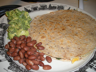 Spinach quesadilla with side of guacamole & pink beans